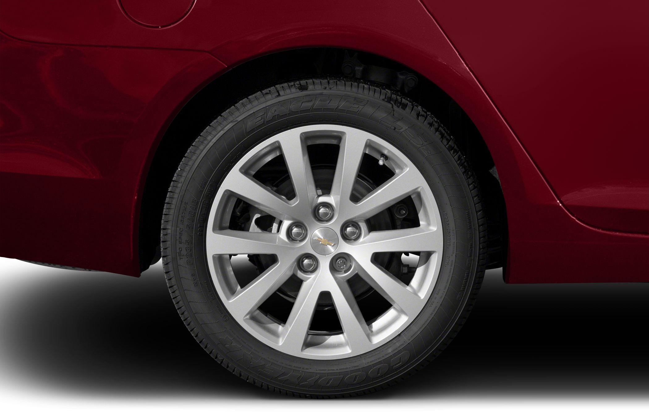 Close-up of alloy wheel with Goodyear tire on red vehicle