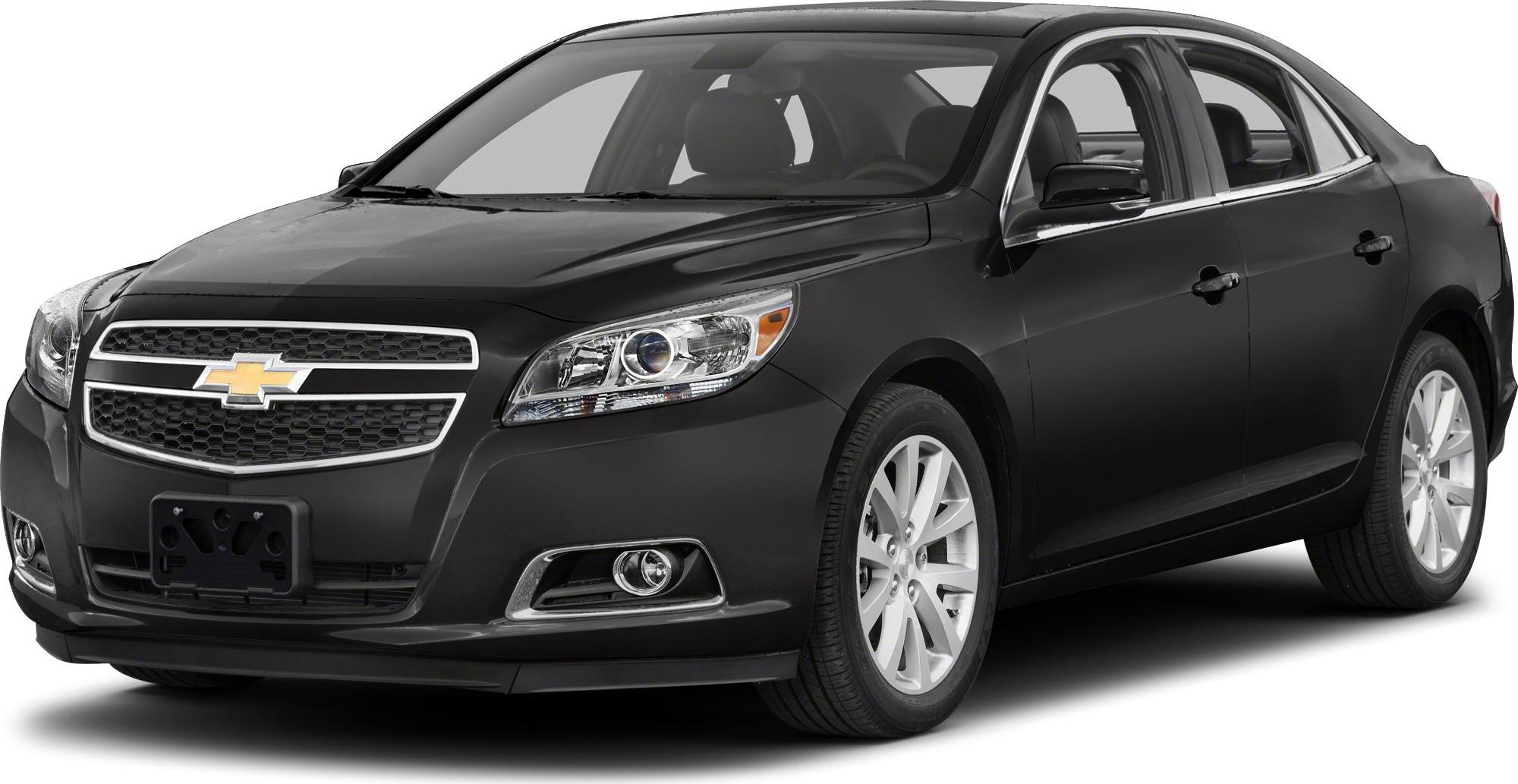 Black sedan with chrome grille and alloy wheels front-side view