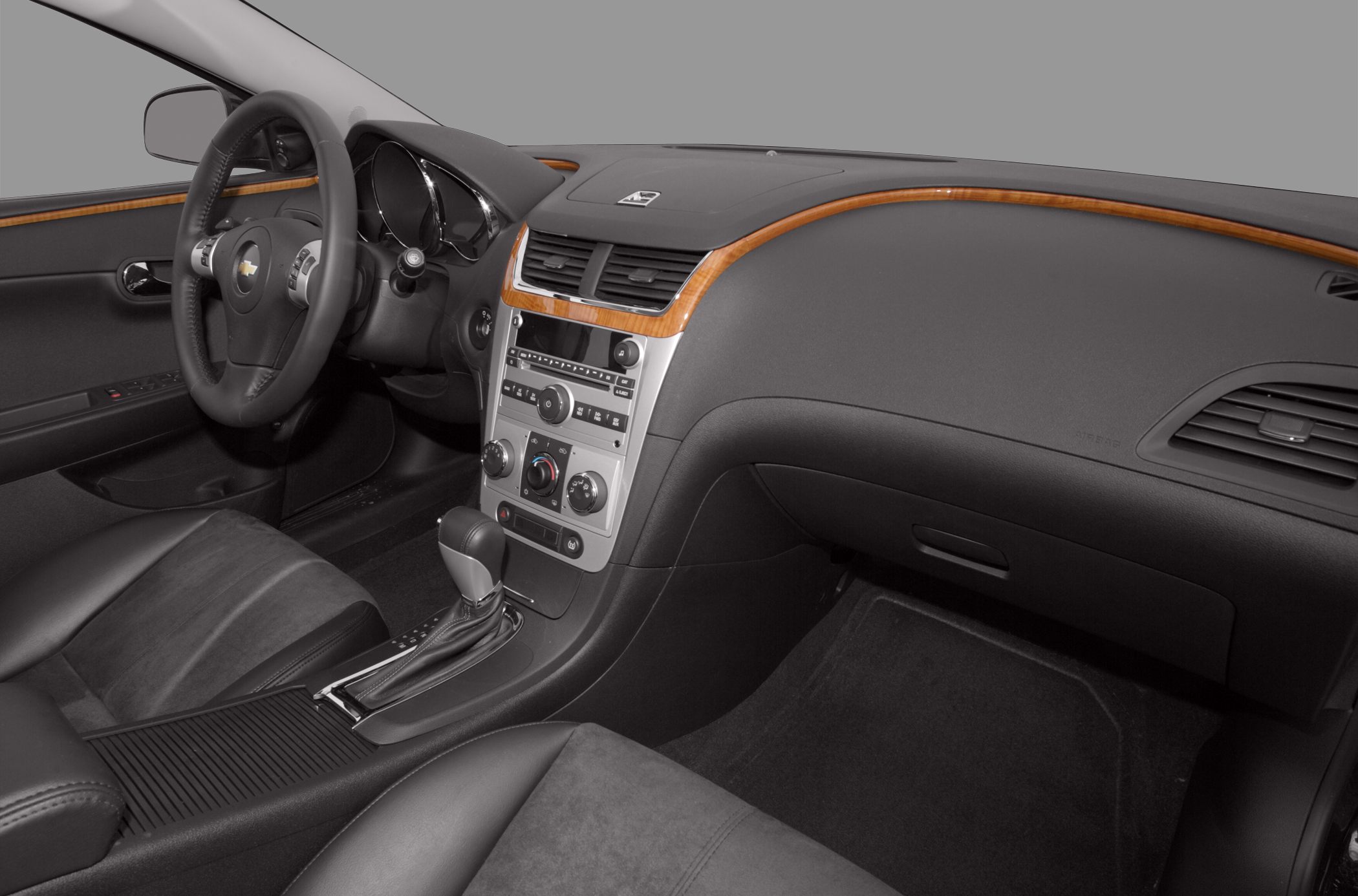 Car interior with wood trim dashboard and automatic gear shift