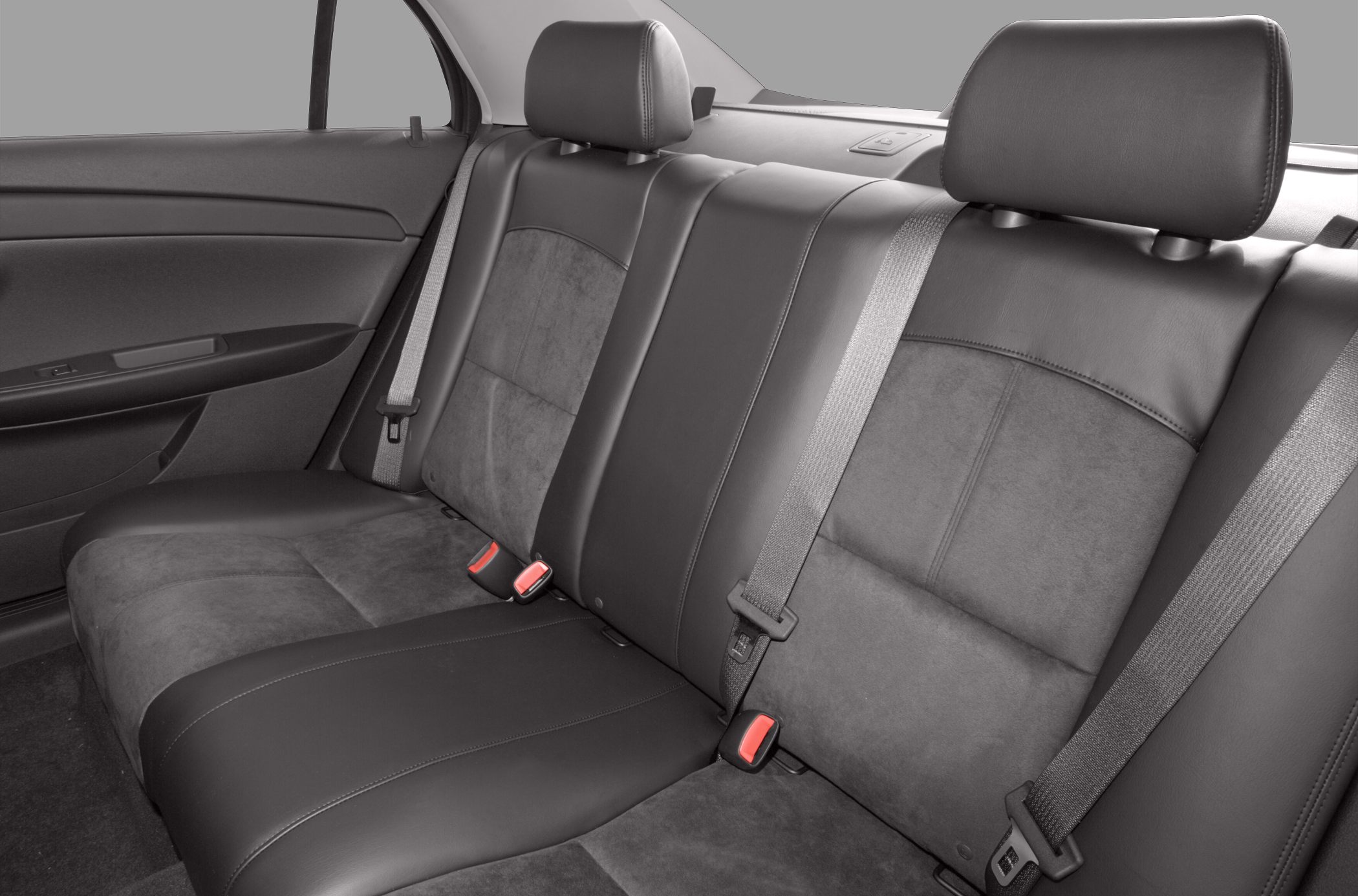 Rear seat upholstery with seat belts and headrests