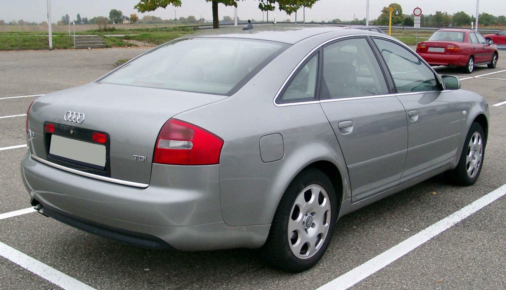 Rear side view of silver sedan with TDI badge and alloy wheels
