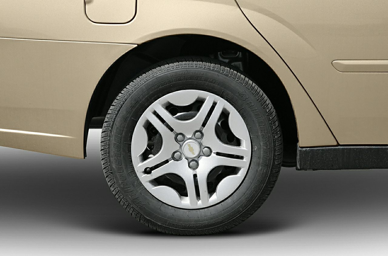 Close-up of alloy wheel and rear fender with tire tread visible