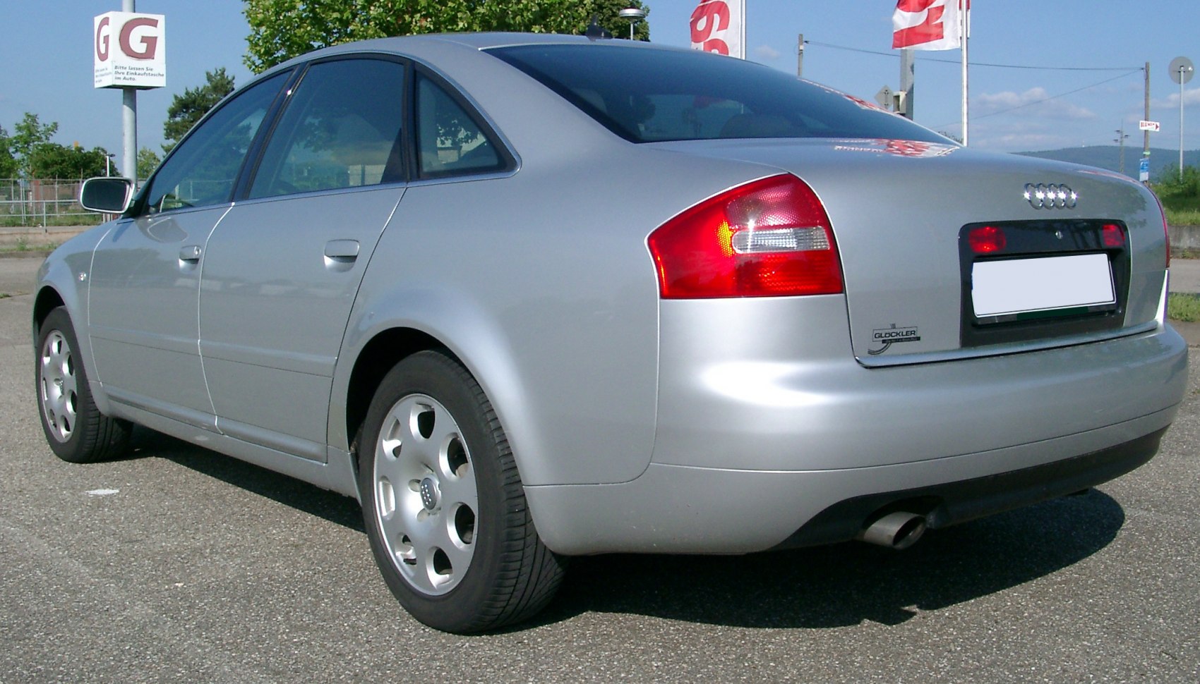 Rear side profile with taillights and alloy wheels