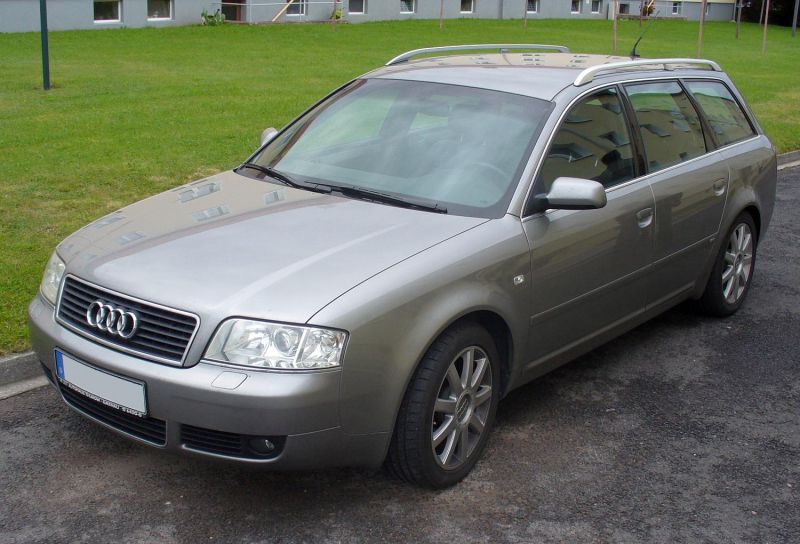Silver station wagon front-side view with roof rails and alloy wheels