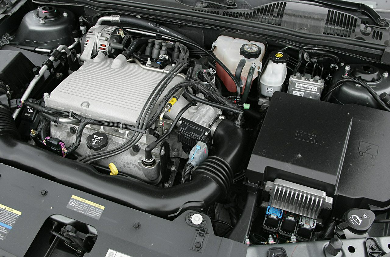 Organized engine bay with visible components and fluid reservoirs.