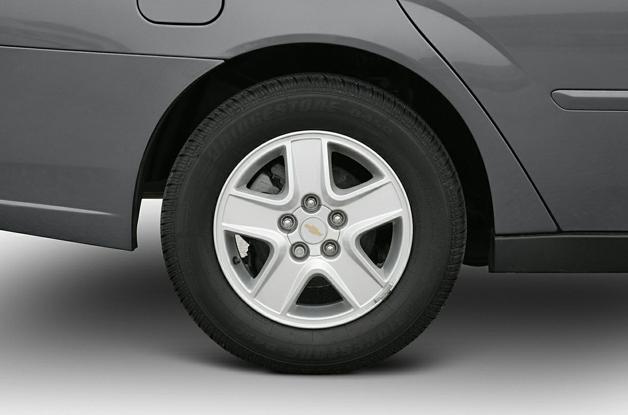 Close-up of 5-spoke alloy wheel with Bridgestone tire on rear quarter panel