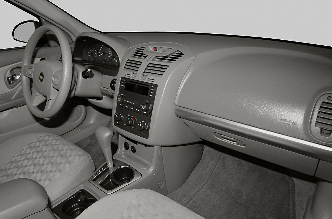 Dashboard, center console with gear shifter and climate controls, steering wheel