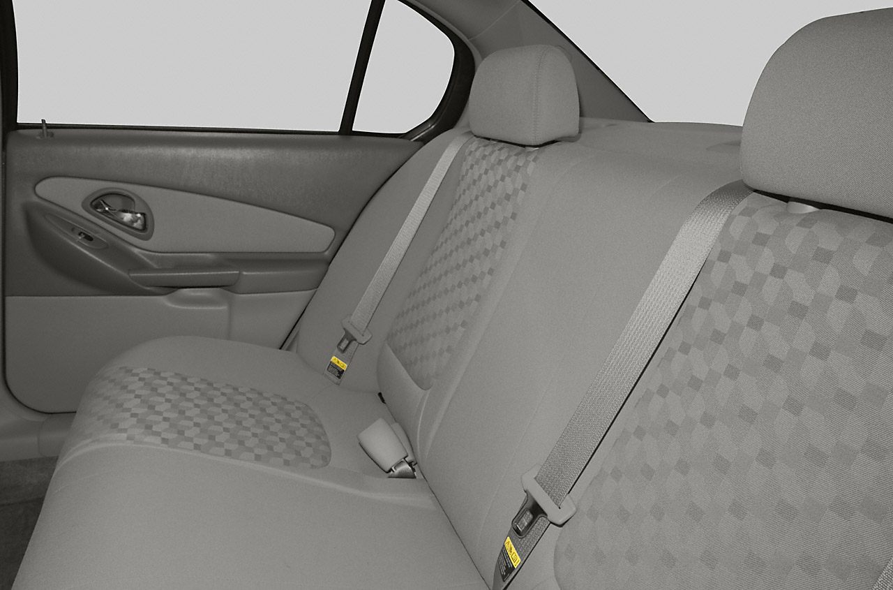 Rear seat upholstery and seatbelts of a sedan interior