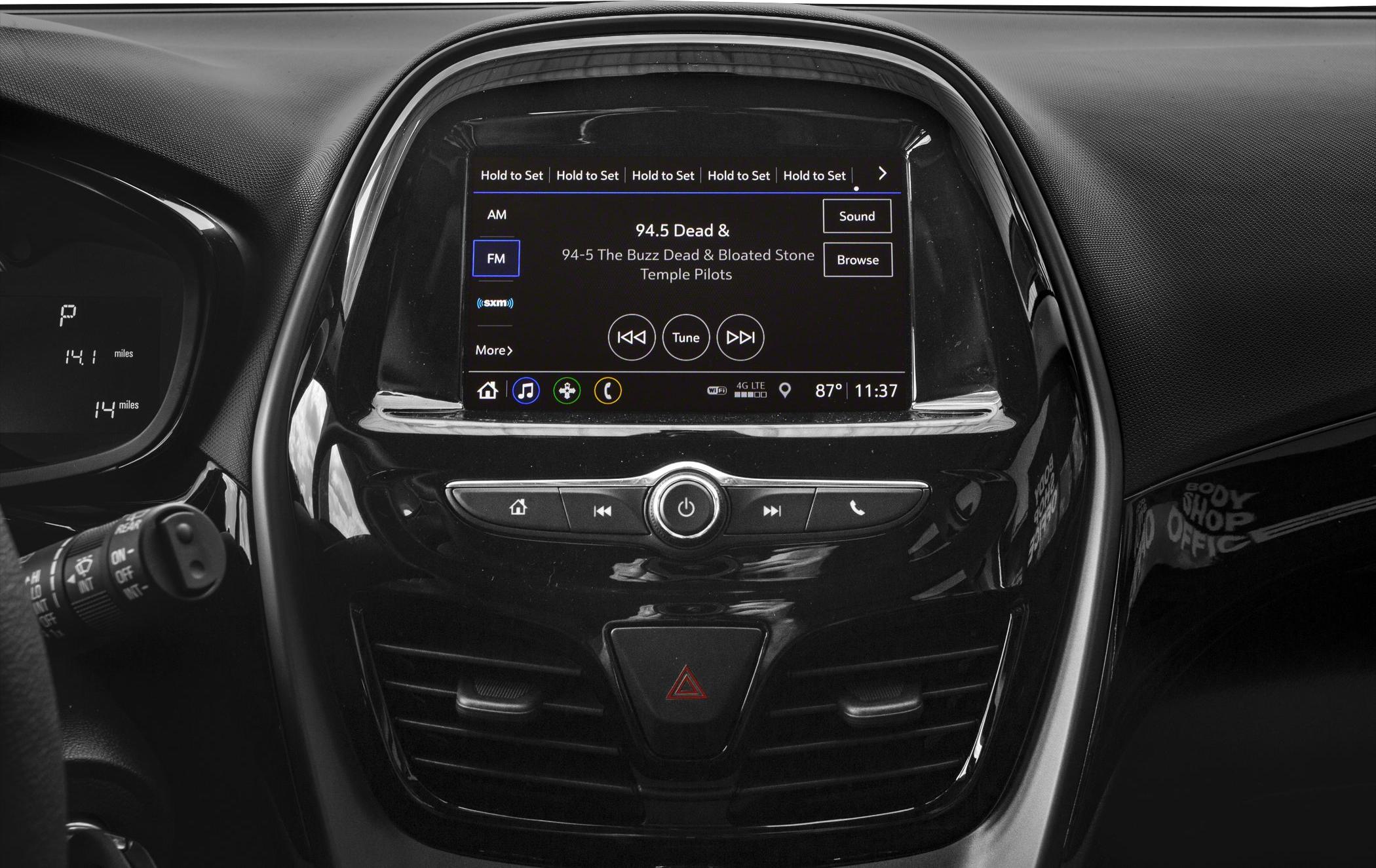 Center console infotainment display with radio and media control buttons