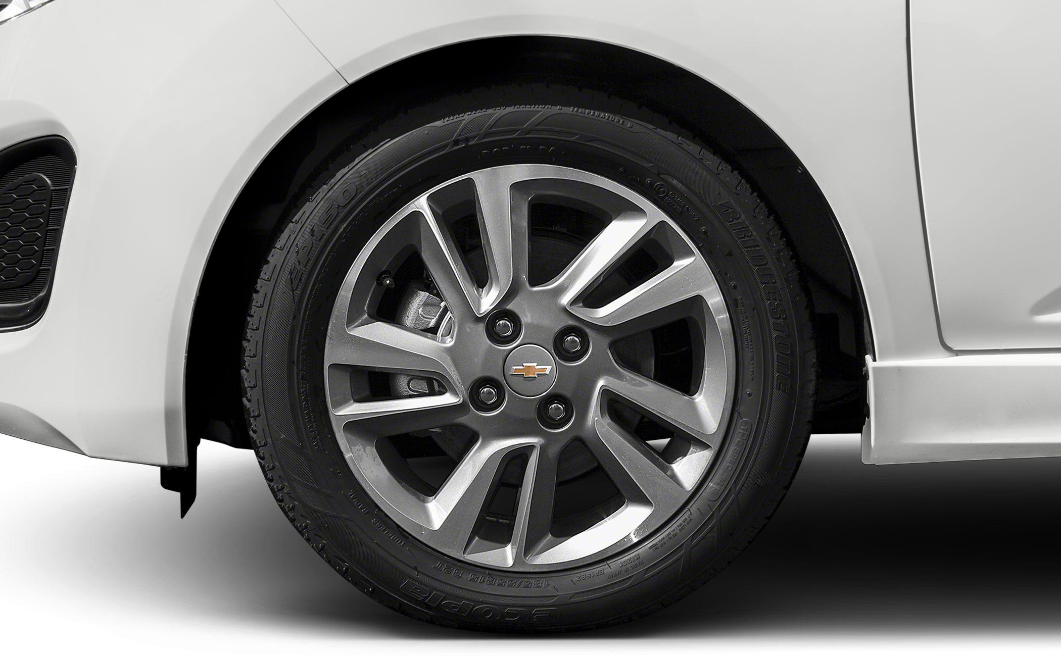 Close-up view of a silver alloy wheel with Bridgestone tire.