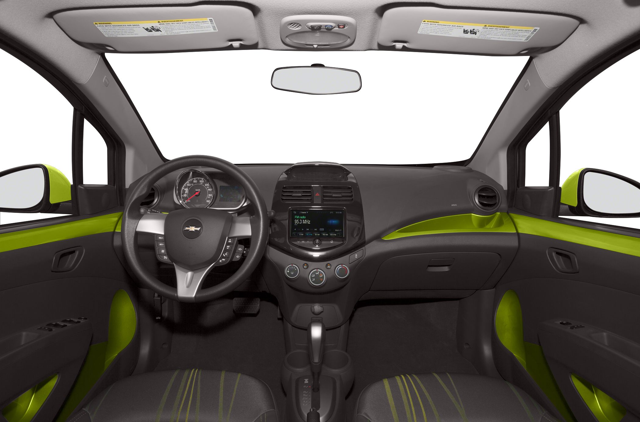 Car interior with dashboard, steering wheel, infotainment screen, and climate controls