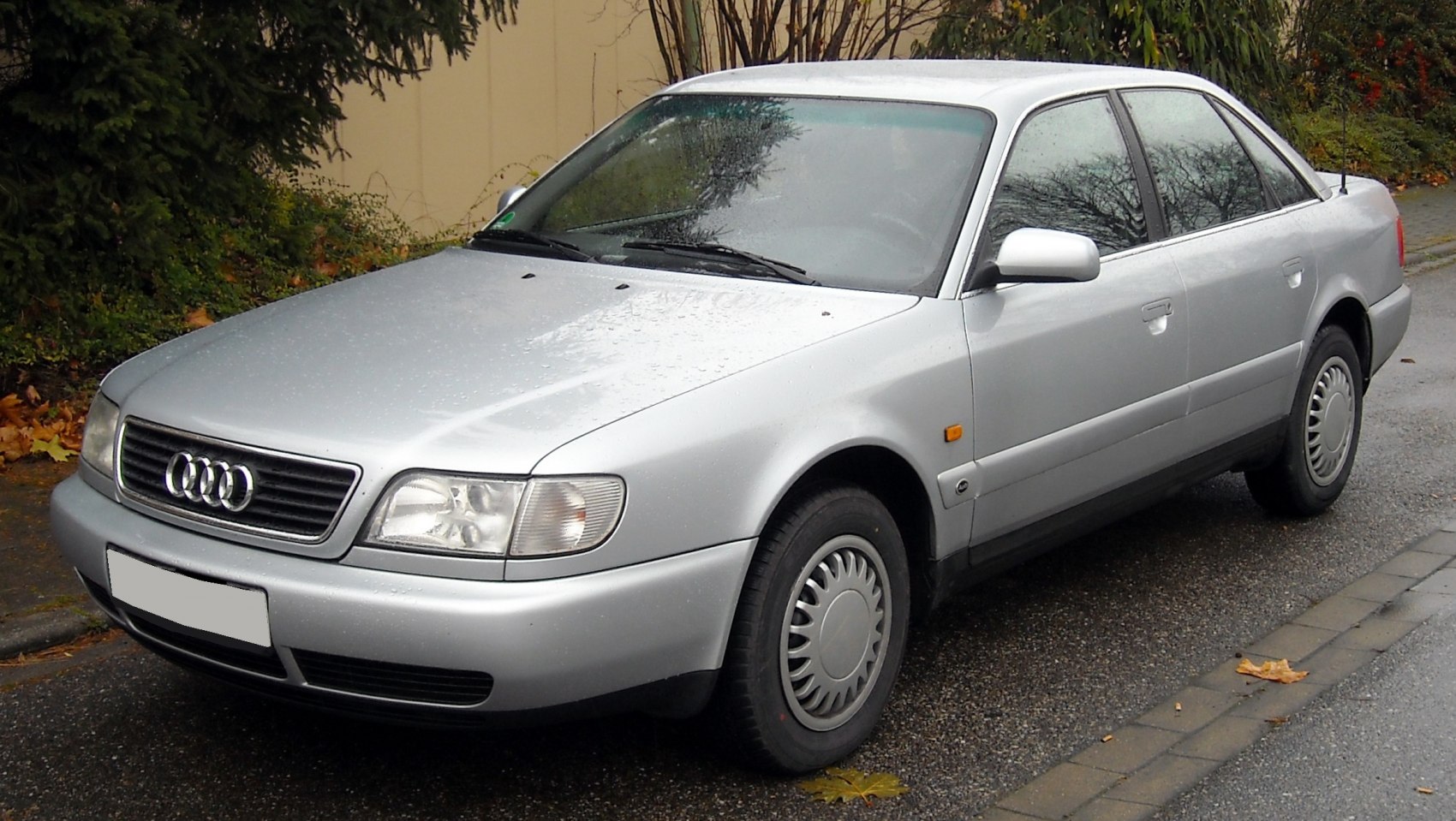 Silver sedan with rounded headlights and distinctive grille
