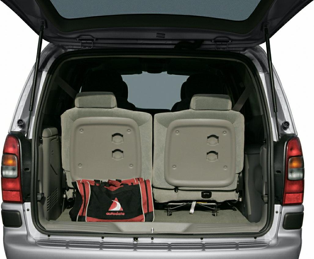 Minivan rear cargo area with foldable seats and storage bag