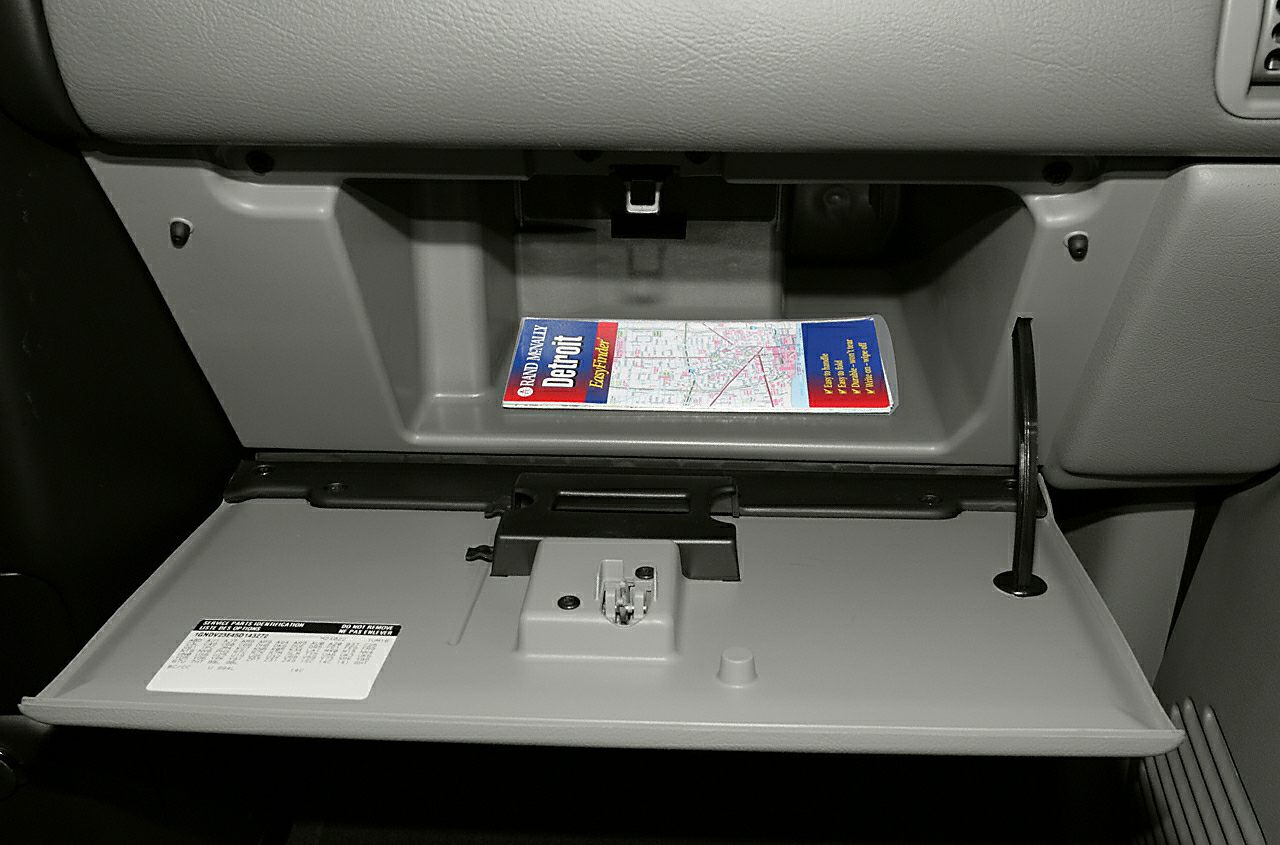 Open glove compartment with a map inside