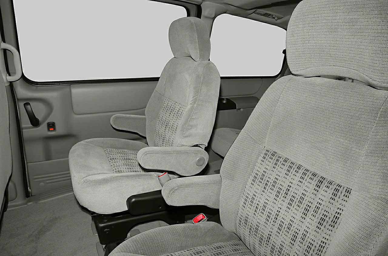 Cloth seats with armrests and distinct upholstery pattern in vehicle interior