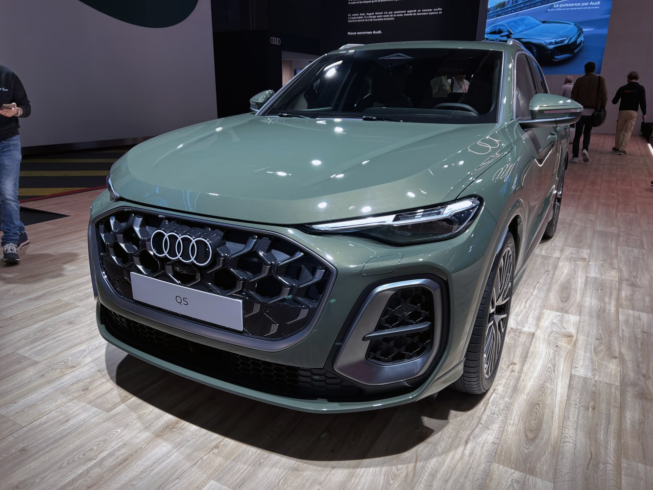 Hexagonal black grille and sleek LED headlights of an SUV front