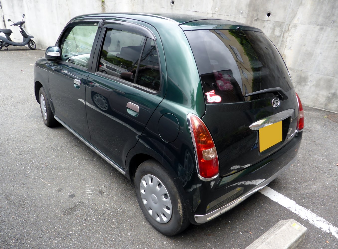 Rear side view of compact hatchback with distinct taillights
