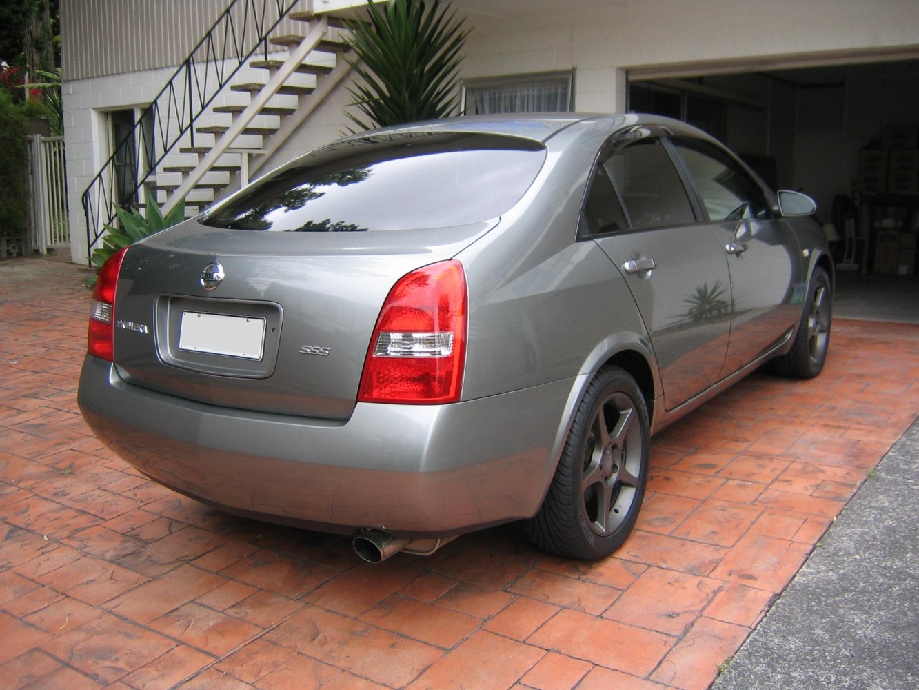 Rear view with tail lights and alloy wheels