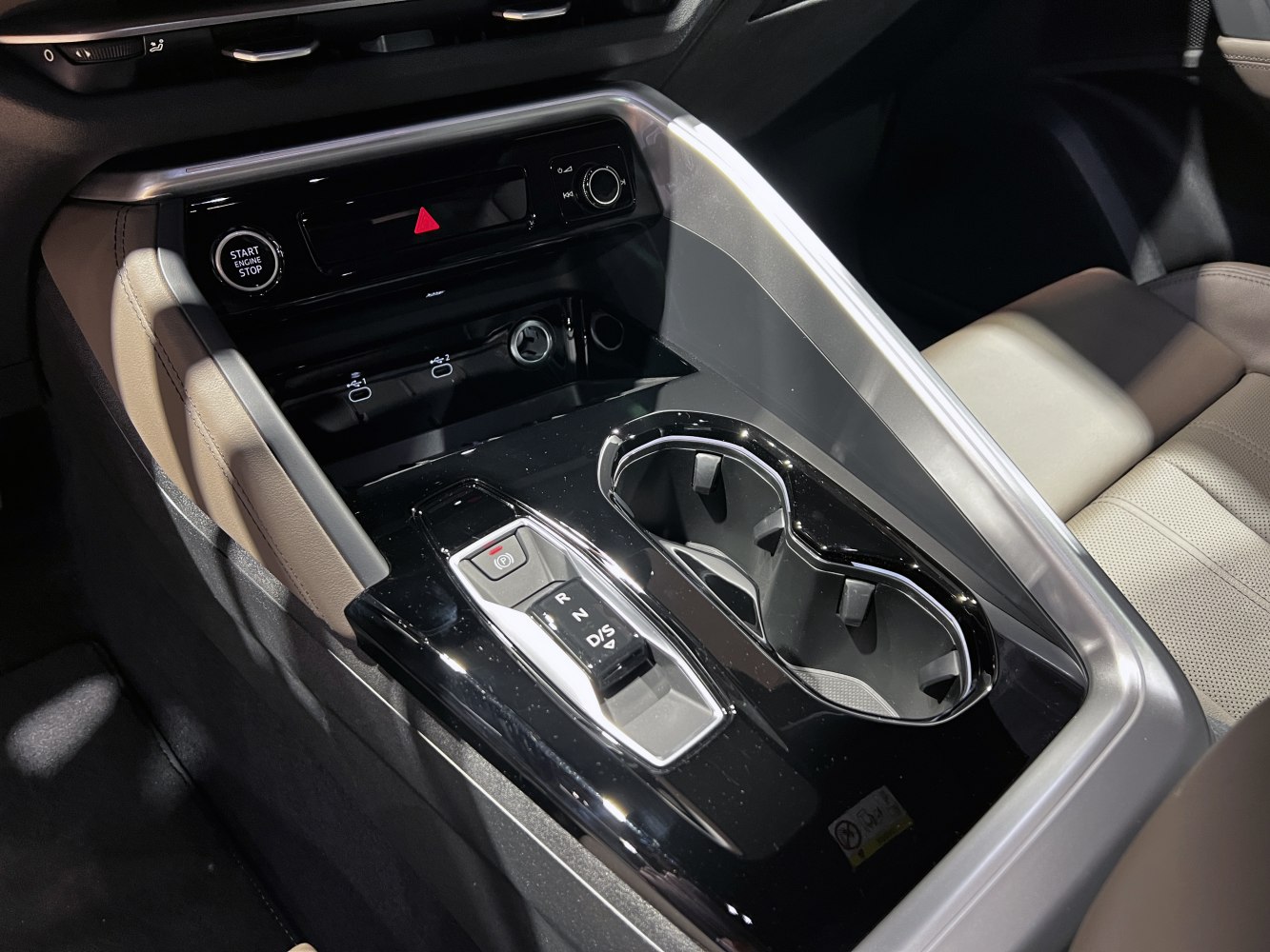 Center console with gear selector, start/stop button, and dual cup holders