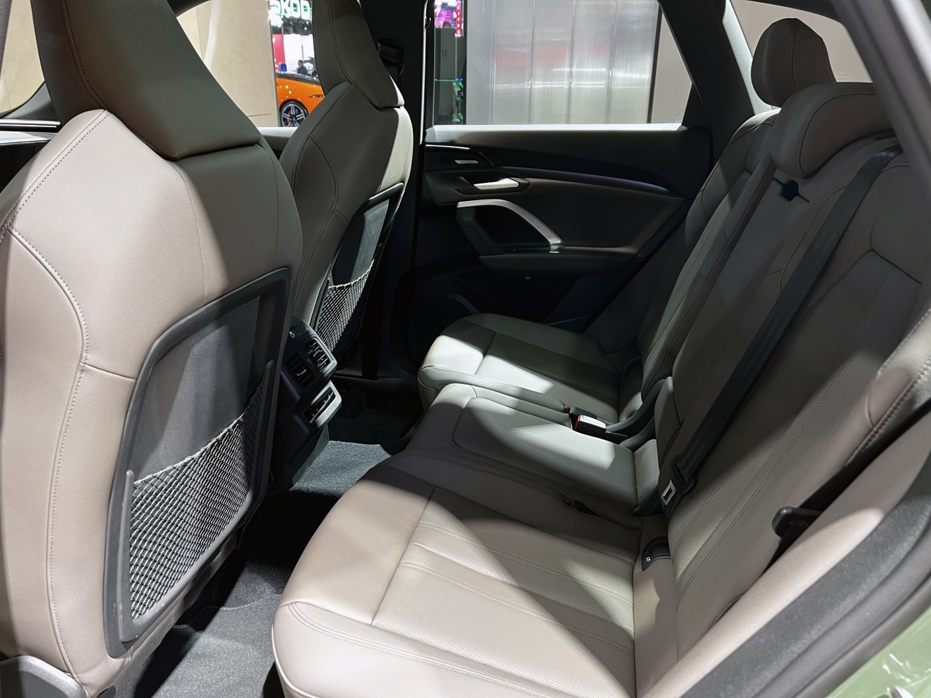 Spacious rear passenger leather seats with rear air vents and door panel design