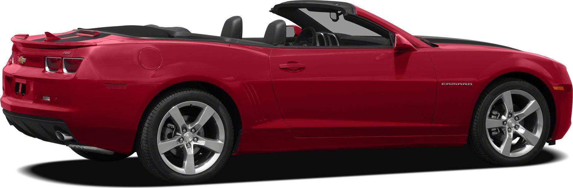 Red convertible with open roof and alloy wheels side view