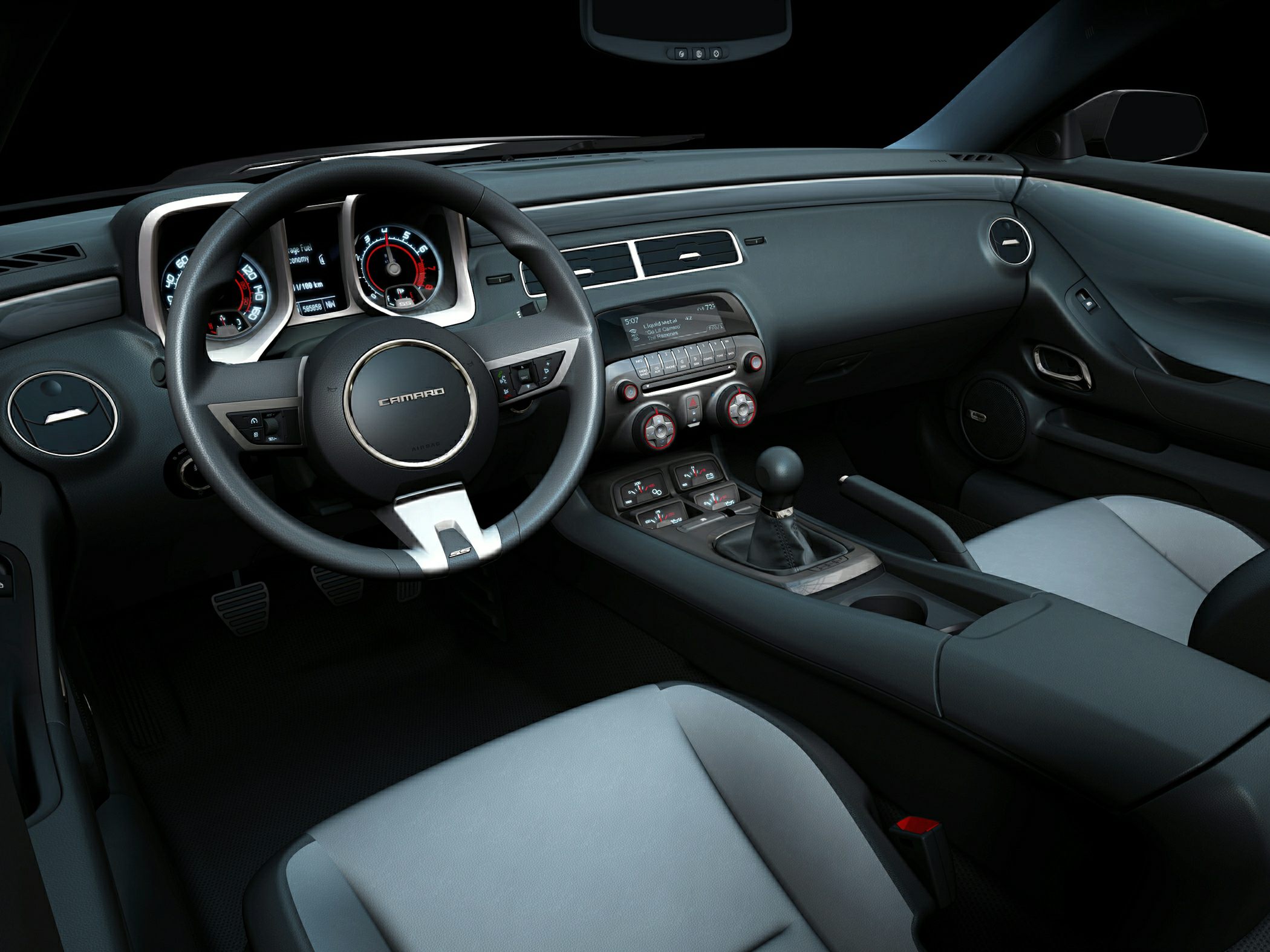 Interior dashboard and steering wheel with manual gearshift.