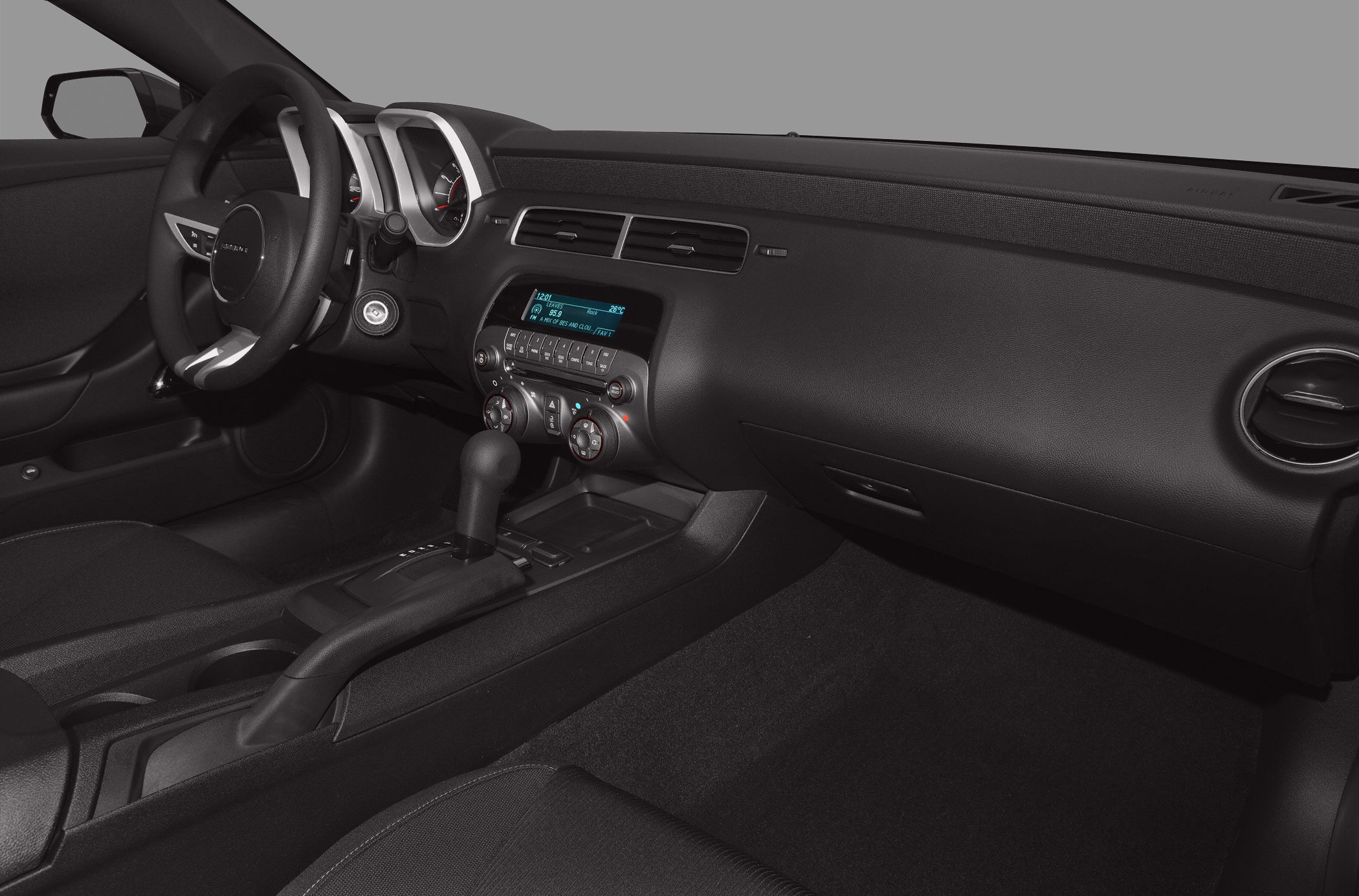 Dashboard and center console with steering wheel and gear shift