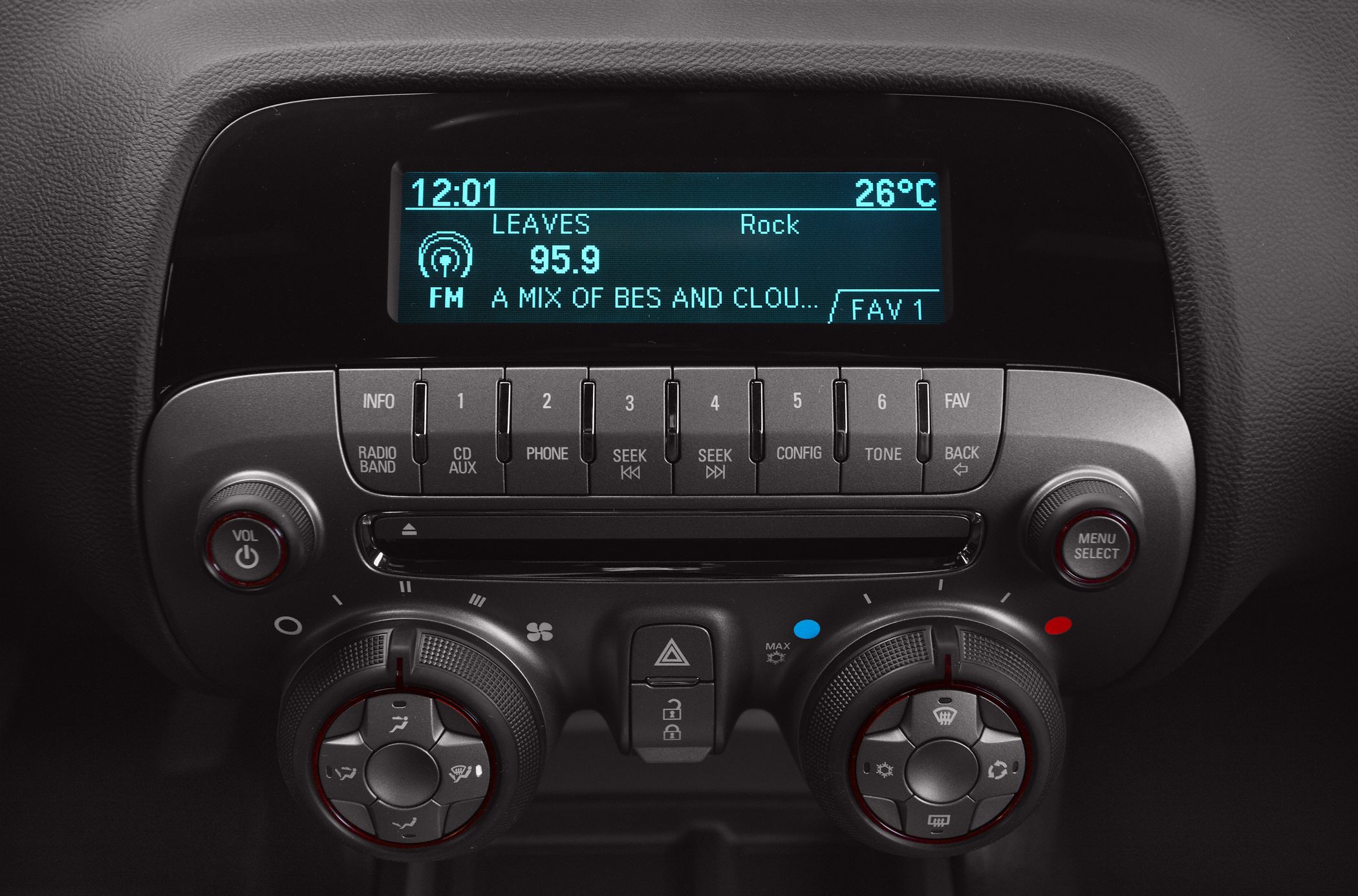Car dashboard radio and climate control knobs with display screen.