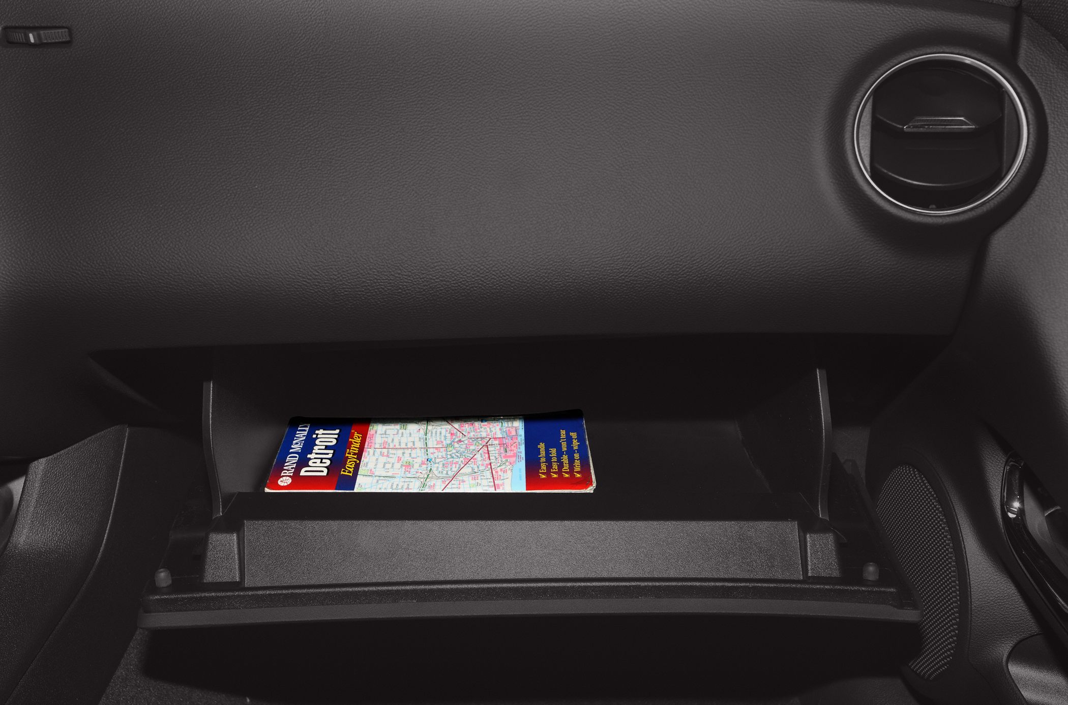 Glove compartment and dashboard air vent interior features