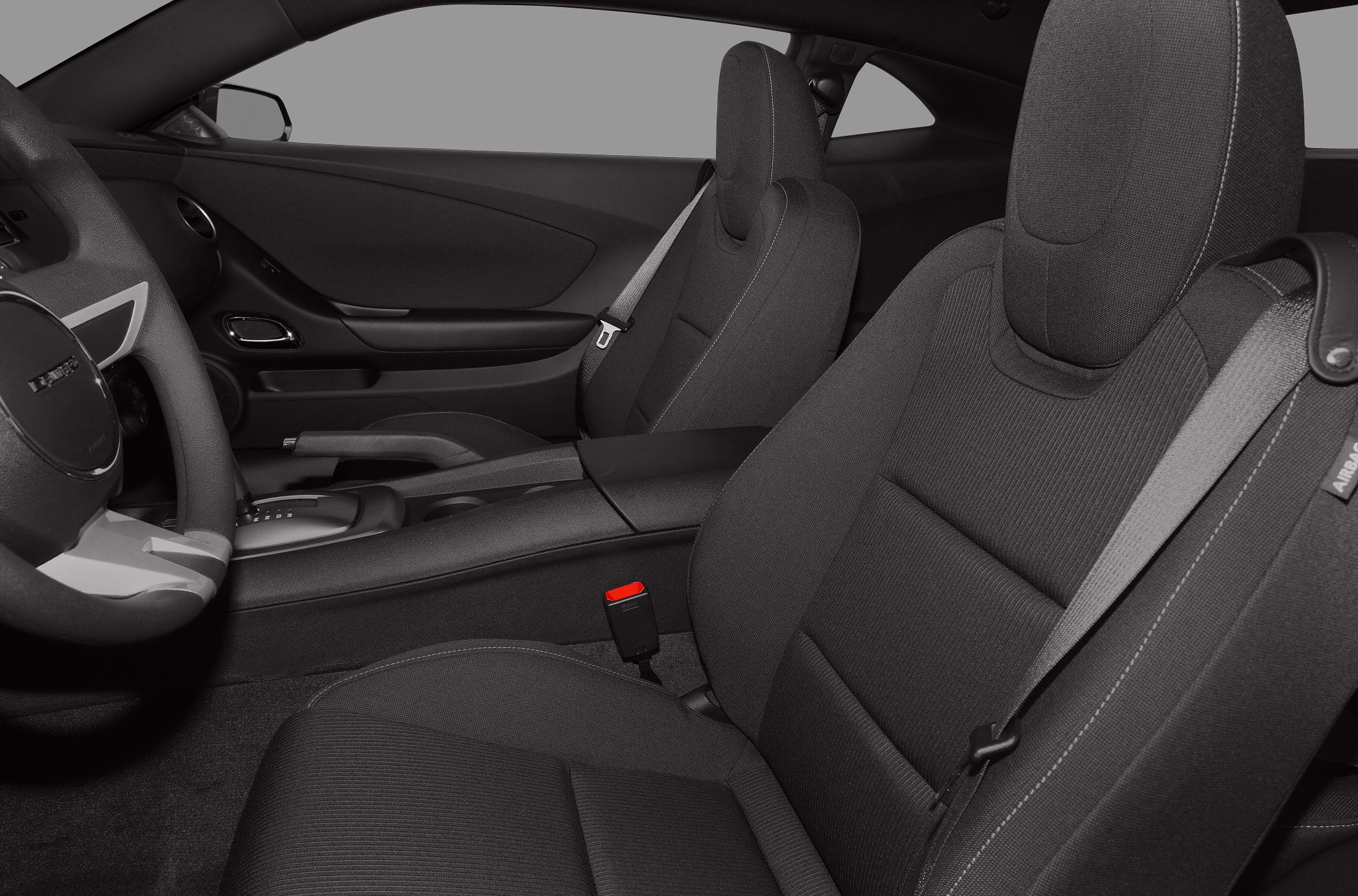 Front seats, dashboard, steering wheel, seatbelt of a sports coupe interior