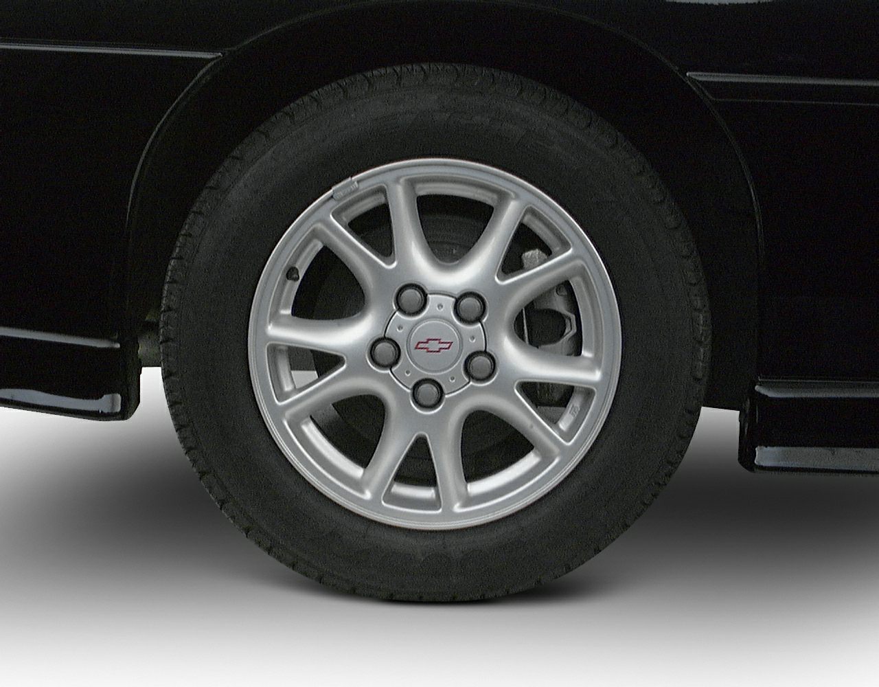 Close-up of alloy wheel with Chevrolet logo and tire
