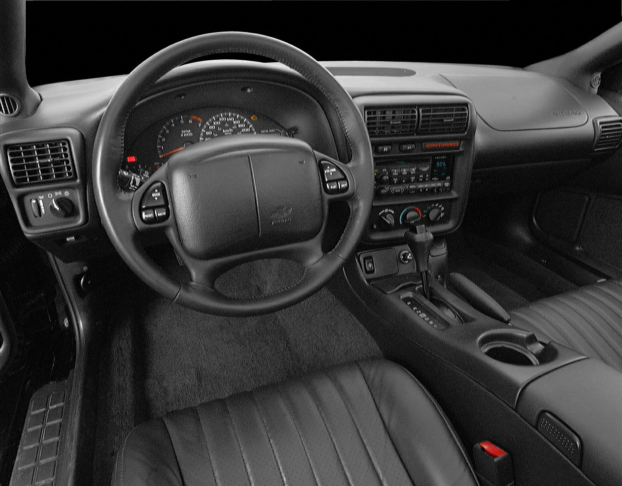 Dashboard and steering wheel view of classic car interior