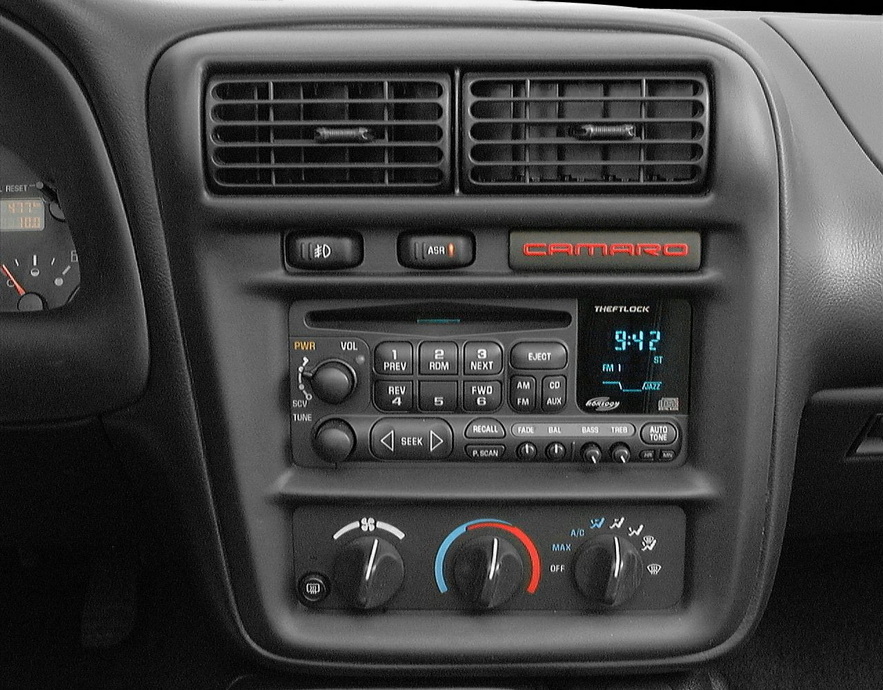 Dashboard center console with radio, climate controls, and Camaro badge