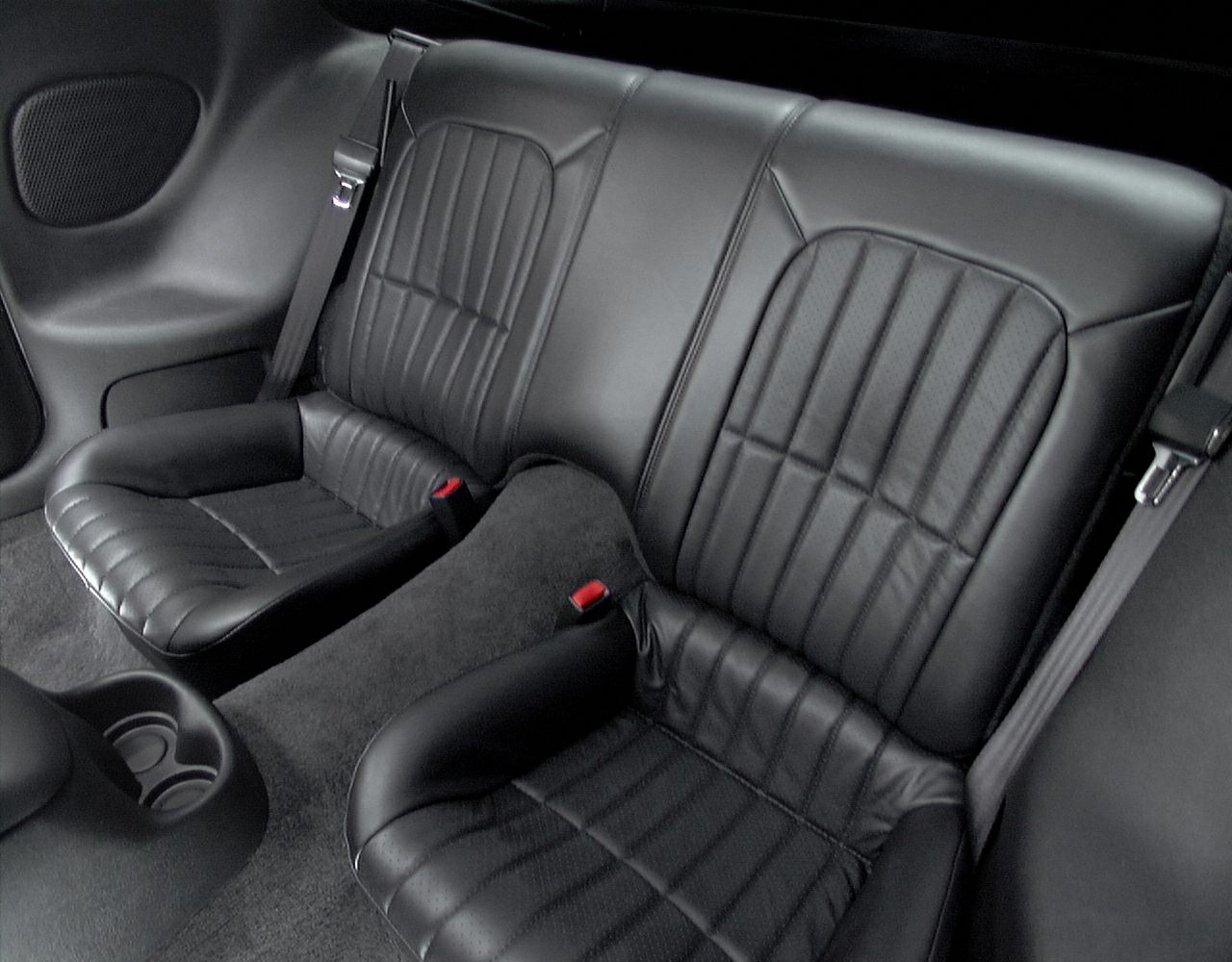 Black leather rear seats with seat belts and cup holder