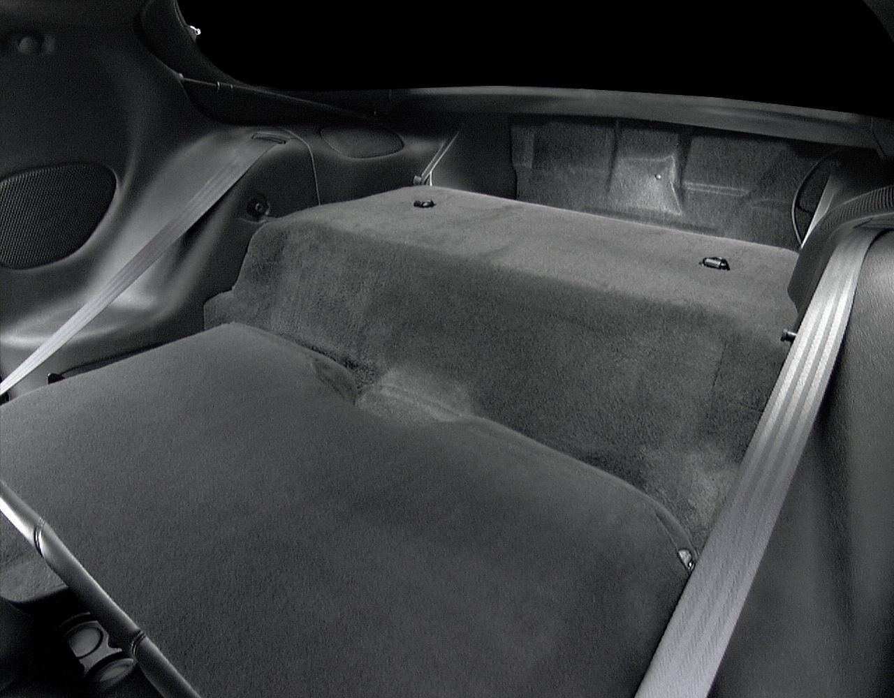 Rear seat area with seatbelts and black upholstery