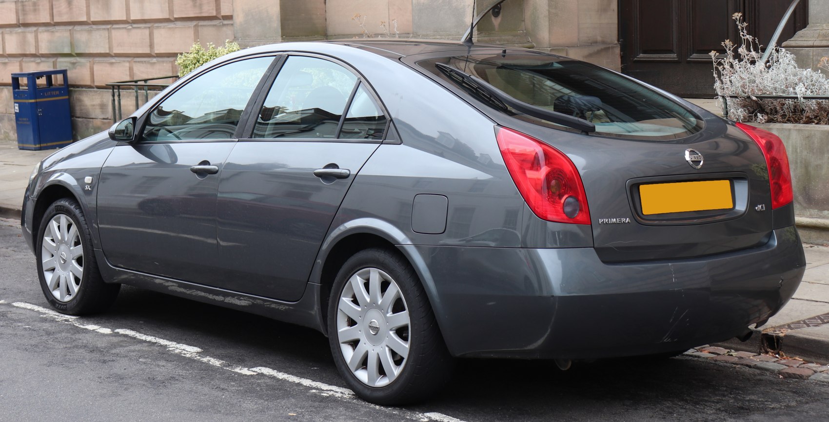 Side and rear view of a hatchback with distinctive tail lights and smooth body lines