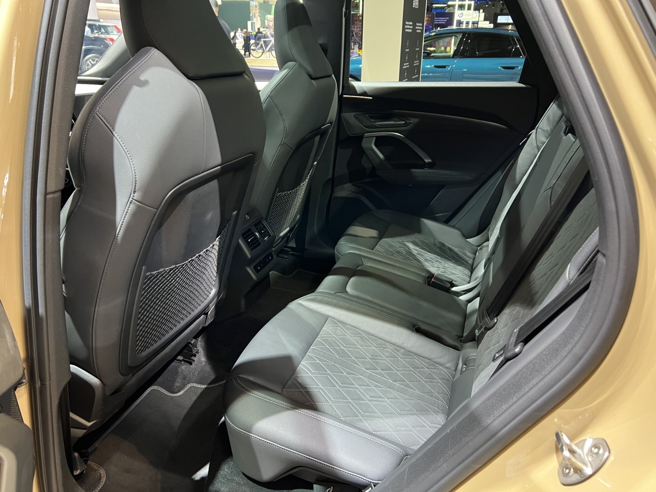 Rear passenger seats with quilted upholstery and spacious legroom