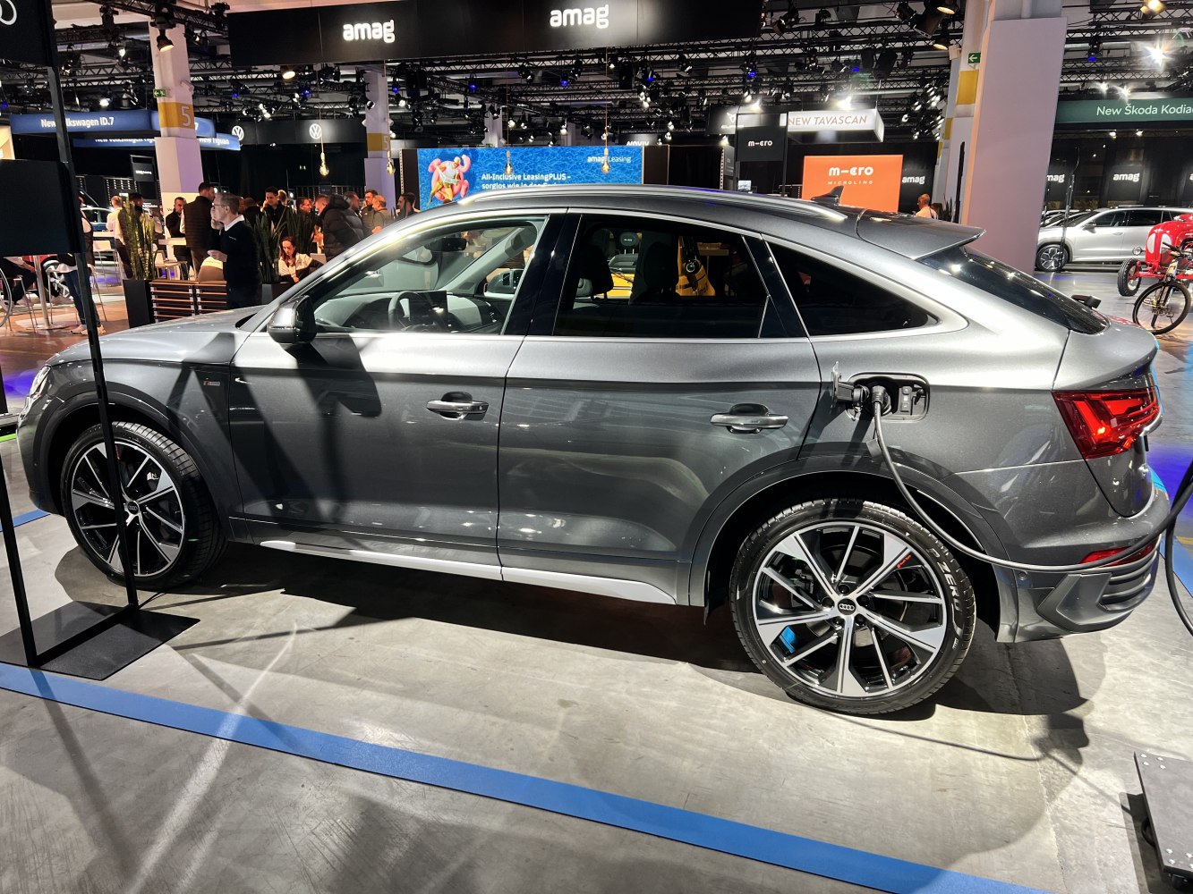 Sportback SUV side profile with electric charging cable