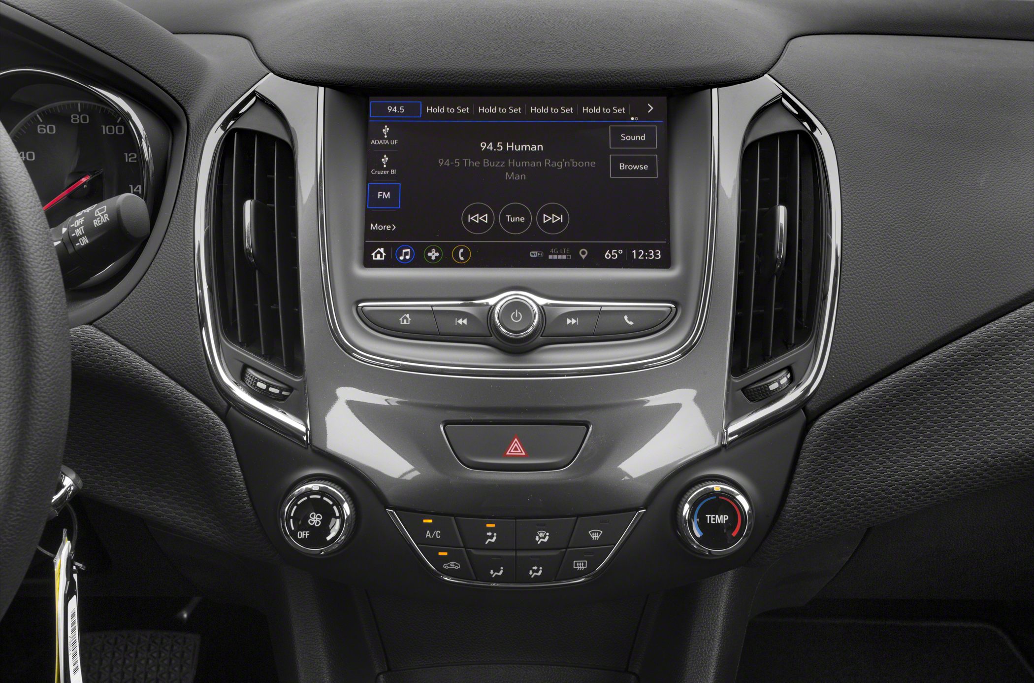 Touchscreen infotainment and dual climate control knobs with air vents