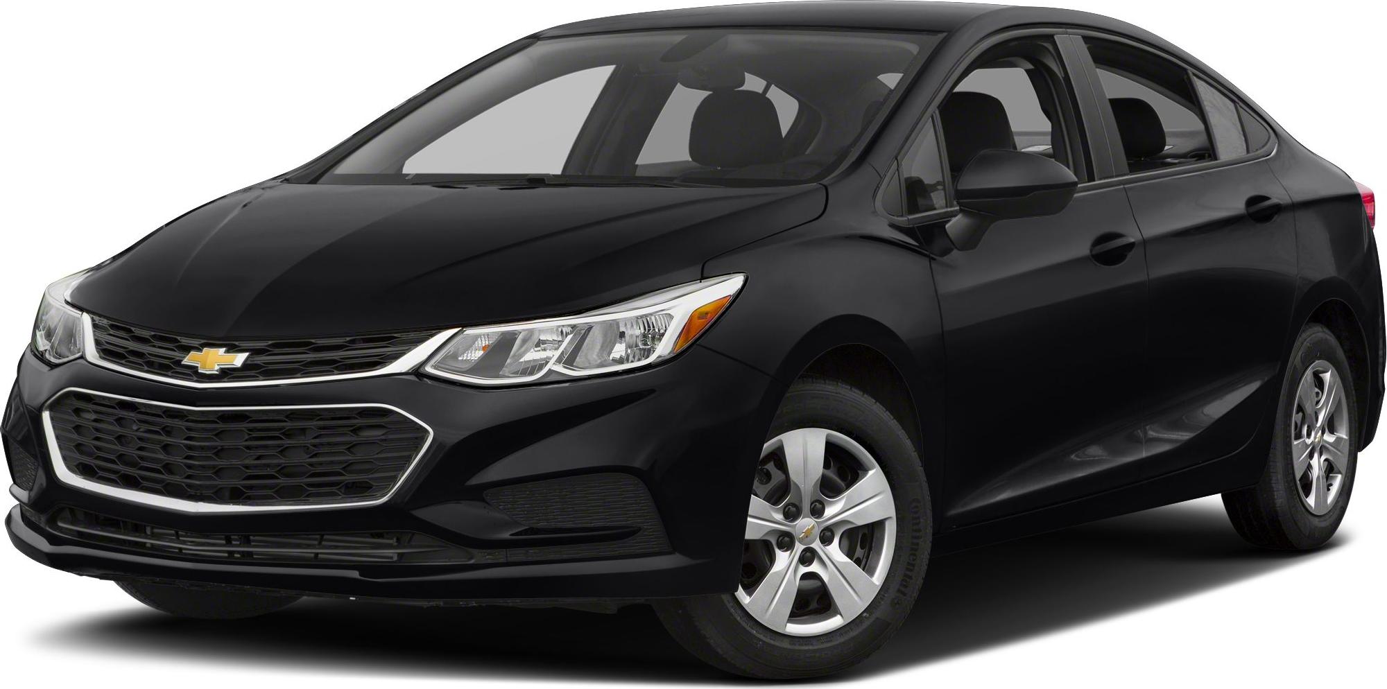 Front side view of a compact sedan with sleek headlights and honeycomb grille