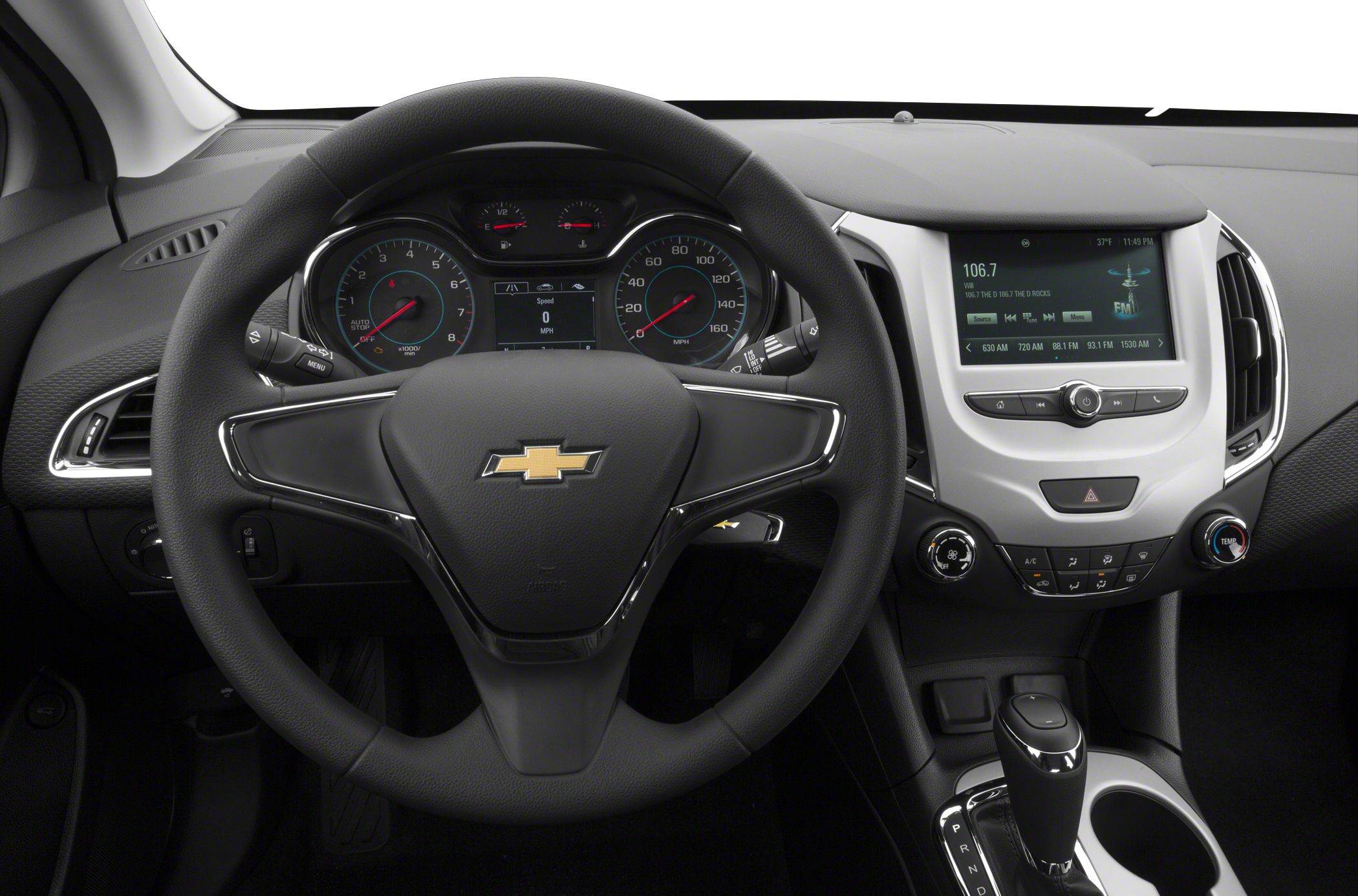 Steering wheel, instrument cluster, infotainment display, climate control panel, gearshift