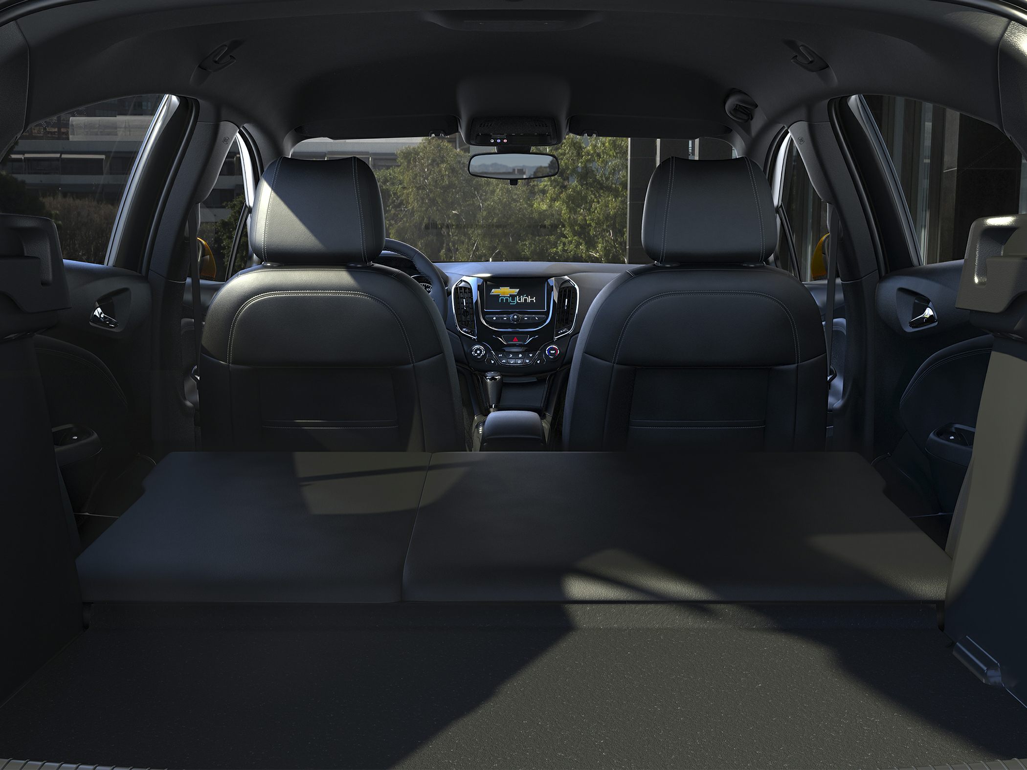 Folded rear seats with front seats and dashboard interior view