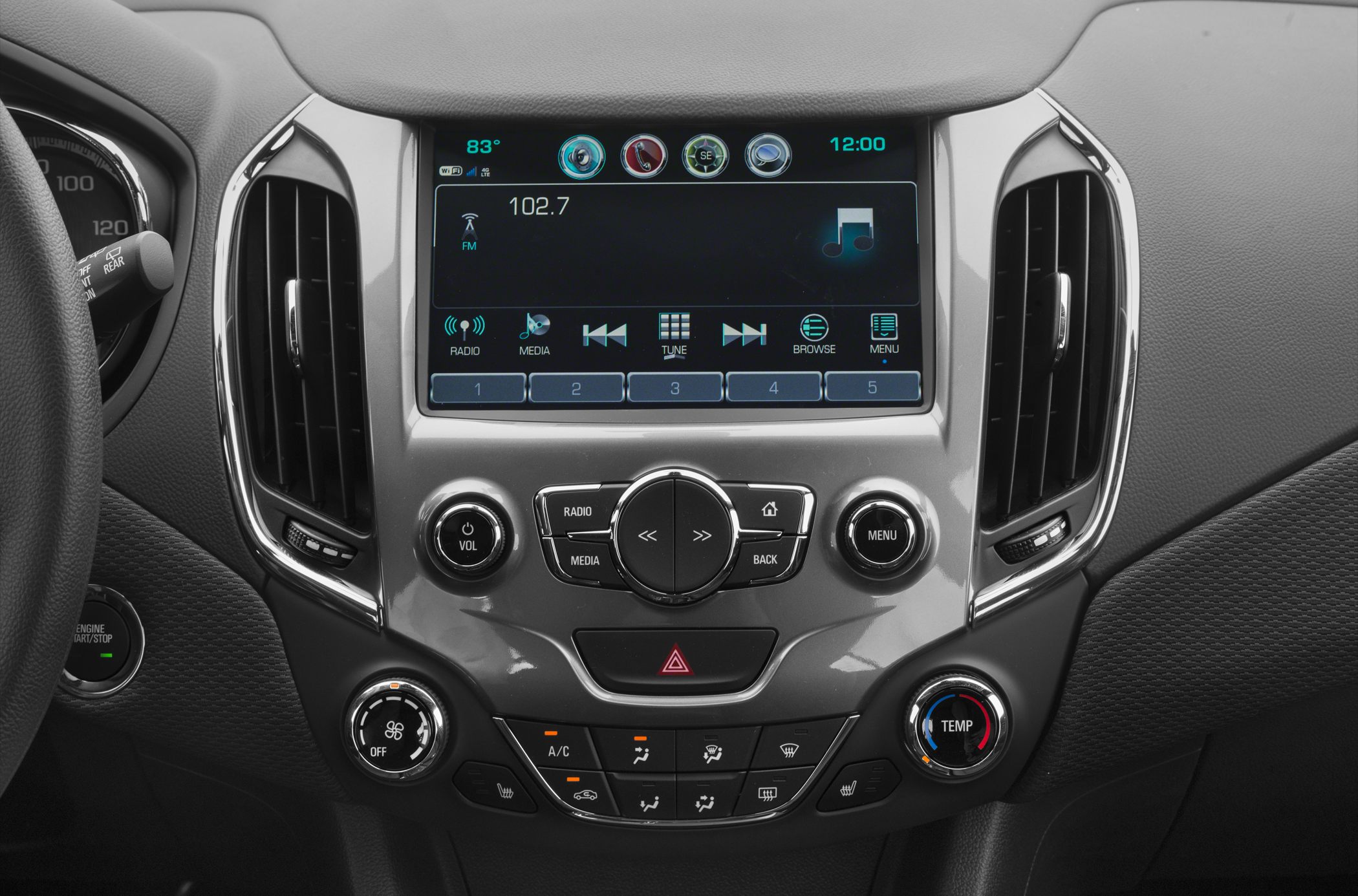 Center console infotainment display with climate control knobs and buttons