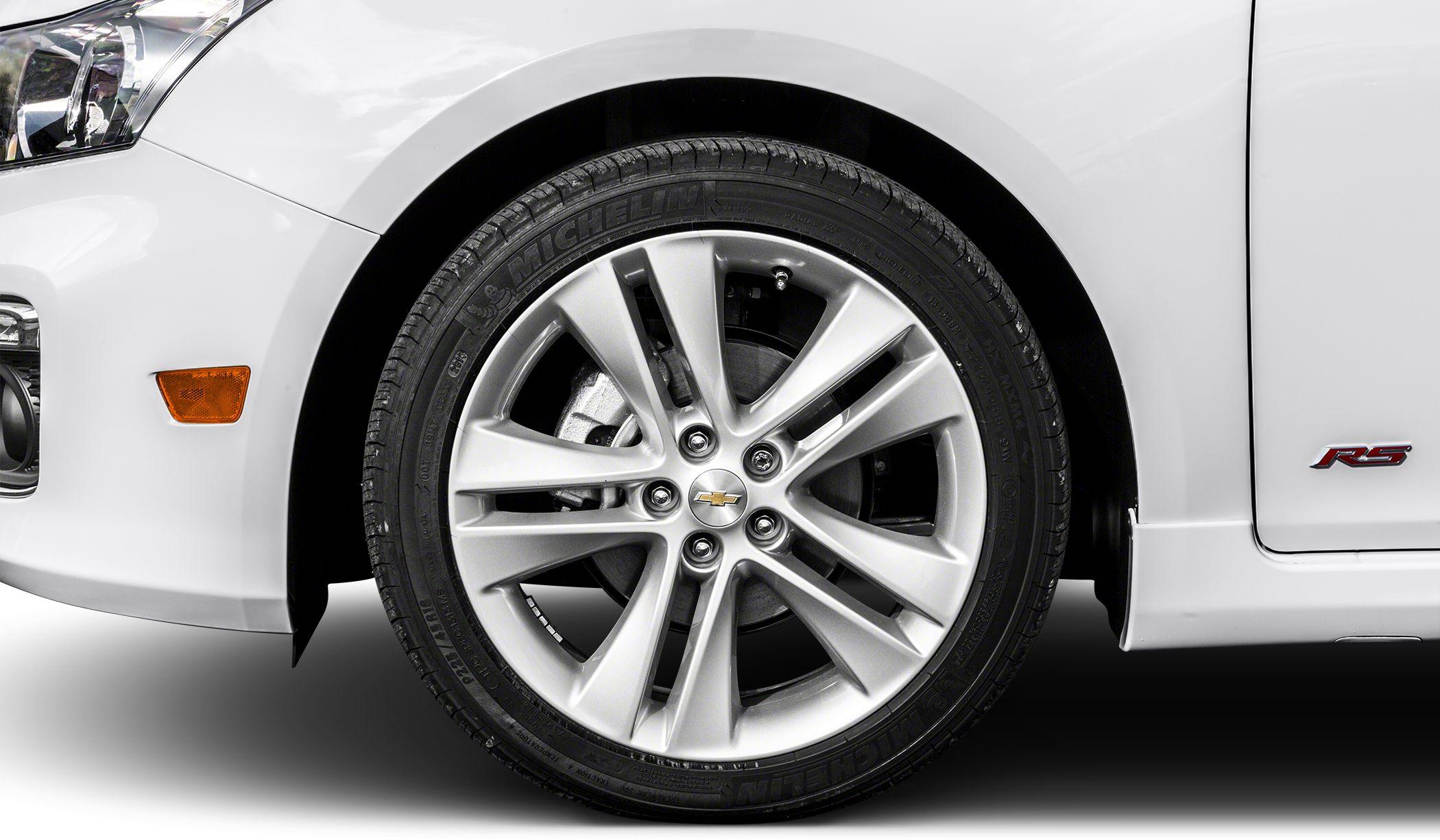 Close-up of alloy wheel, tire, front fender with RS badge and headlight edge