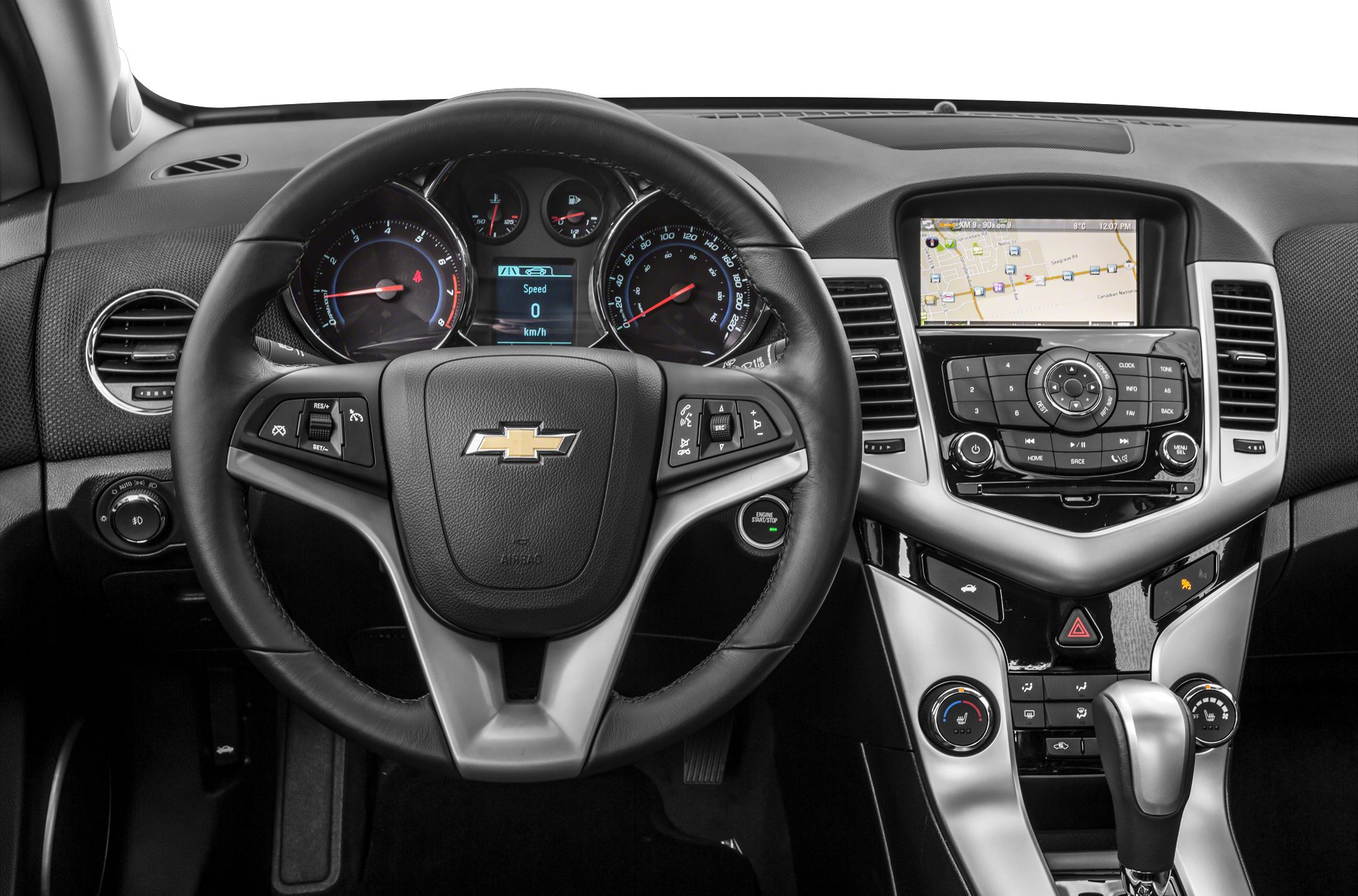 Steering wheel, instrument cluster, central infotainment display and gear shifter.