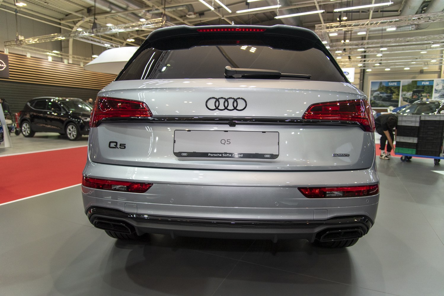Rear view with LED tail lights, quattro badge, dual exhaust, modern bumper design