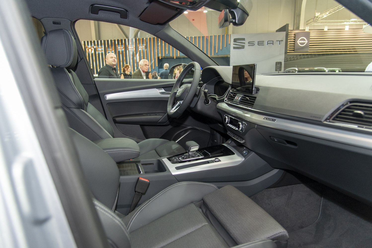Modern car interior with leather seats and digital dashboard display