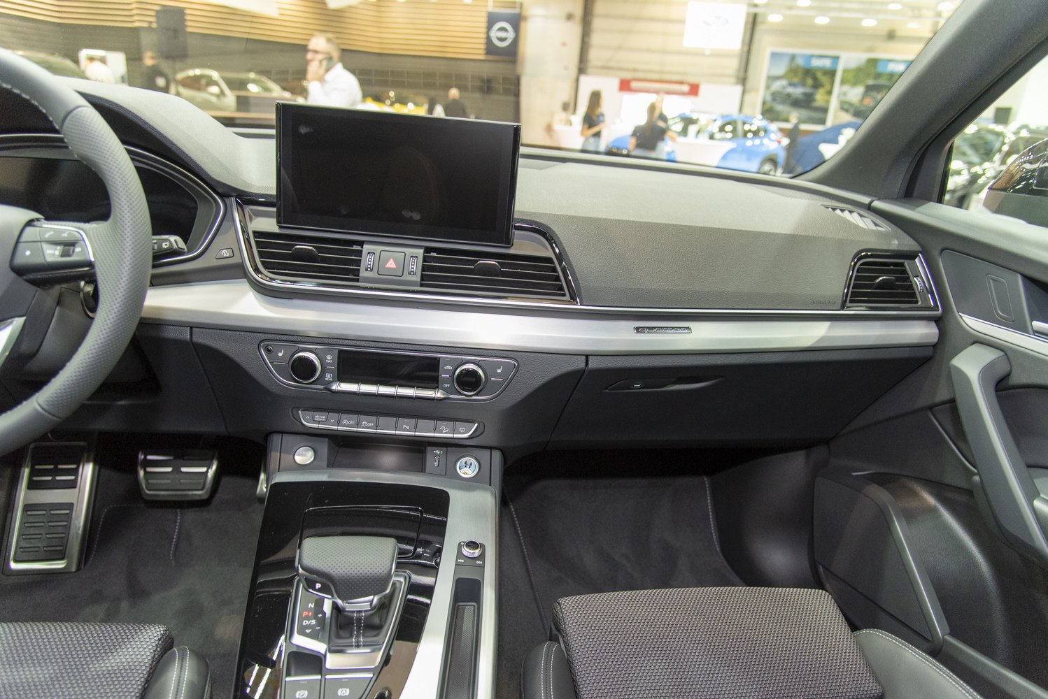 Modern dashboard and center console with digital display and gear shifter
