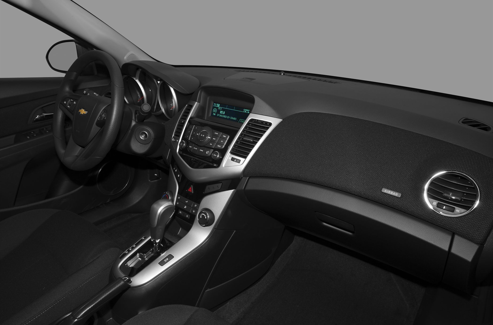 Interior dashboard with steering wheel, center console, and digital display