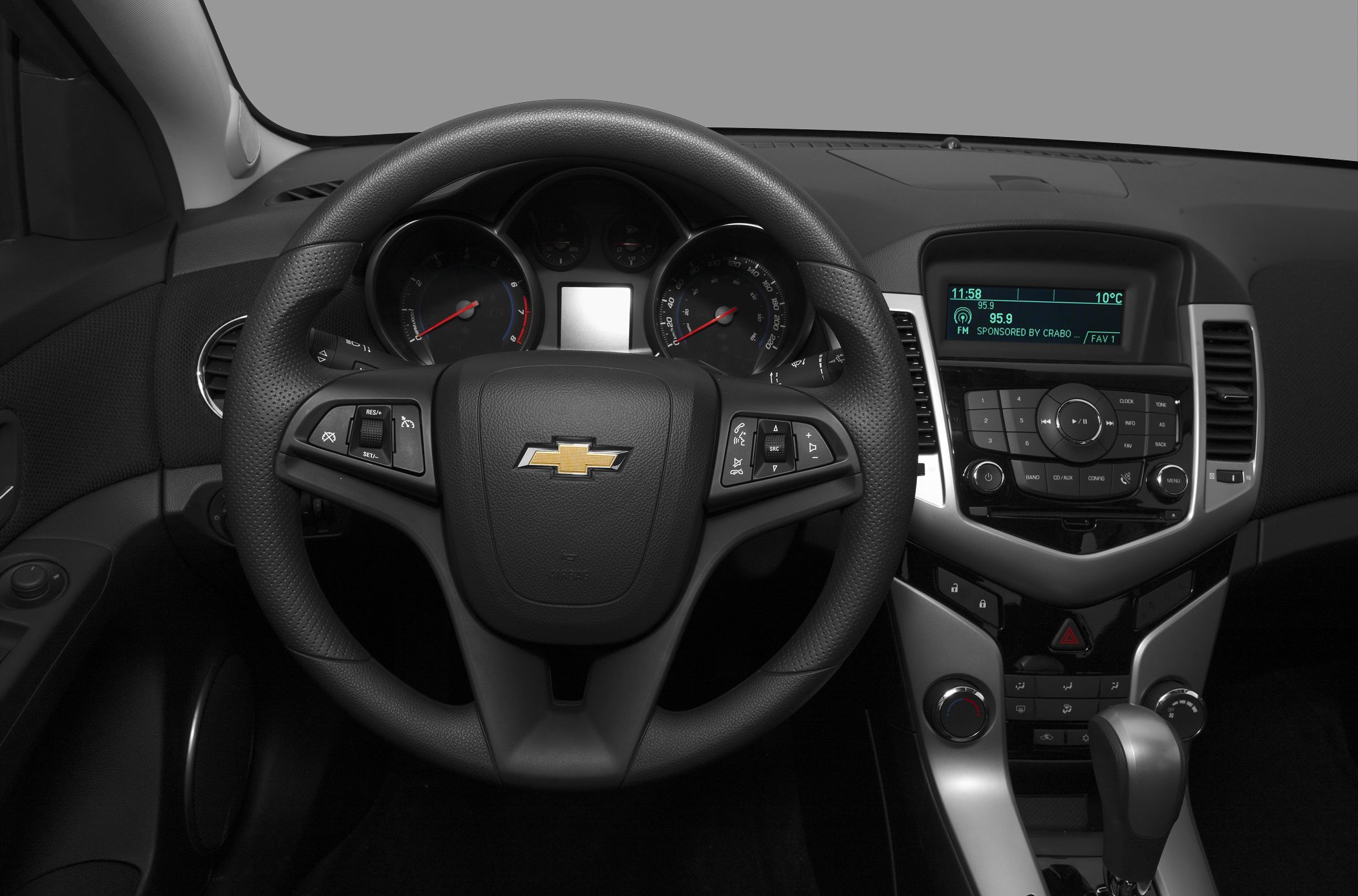 Steering wheel and dashboard with control buttons and digital display